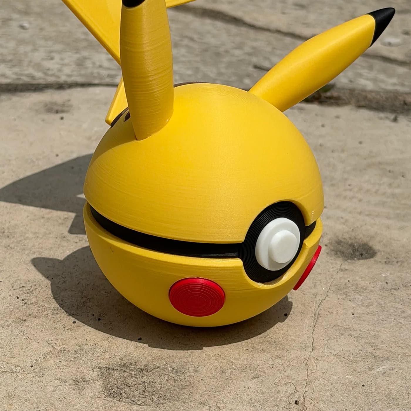 Pikachu character ball with ears and lightning-bolt tail