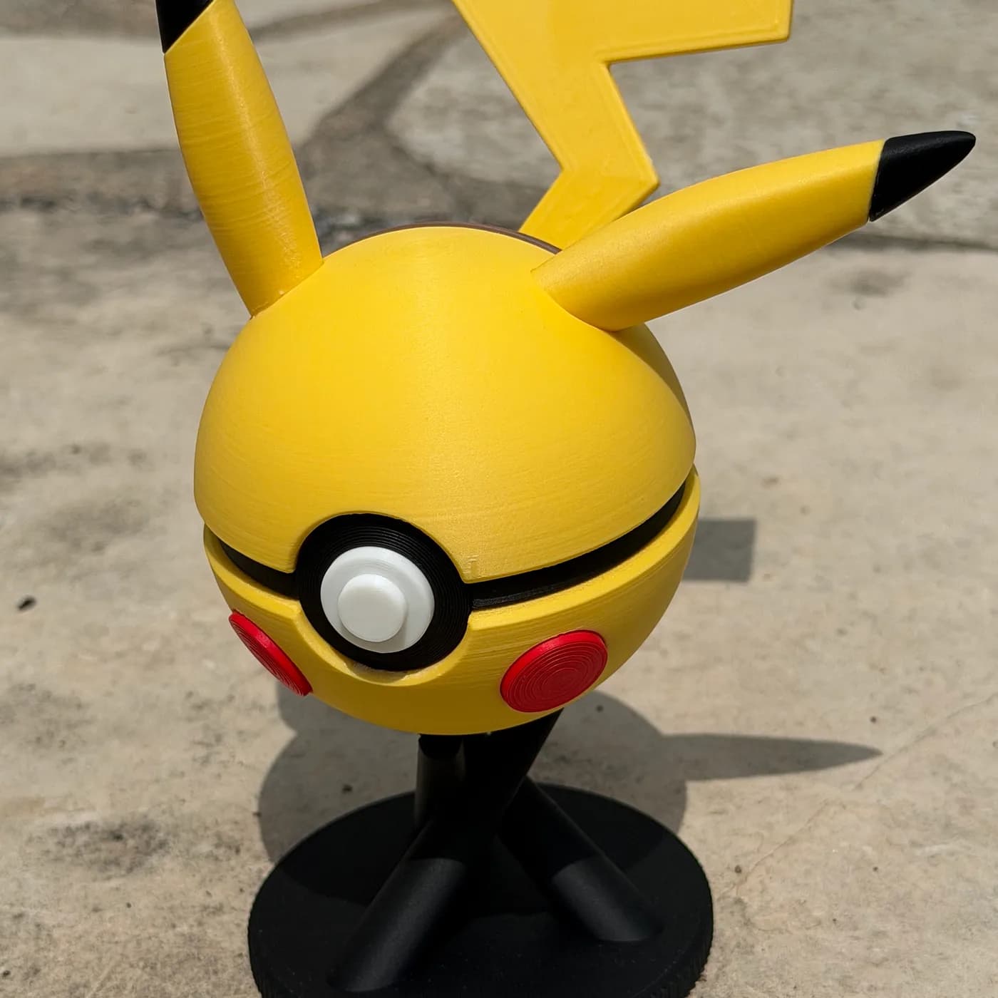 Pikachu character ball on its display stand