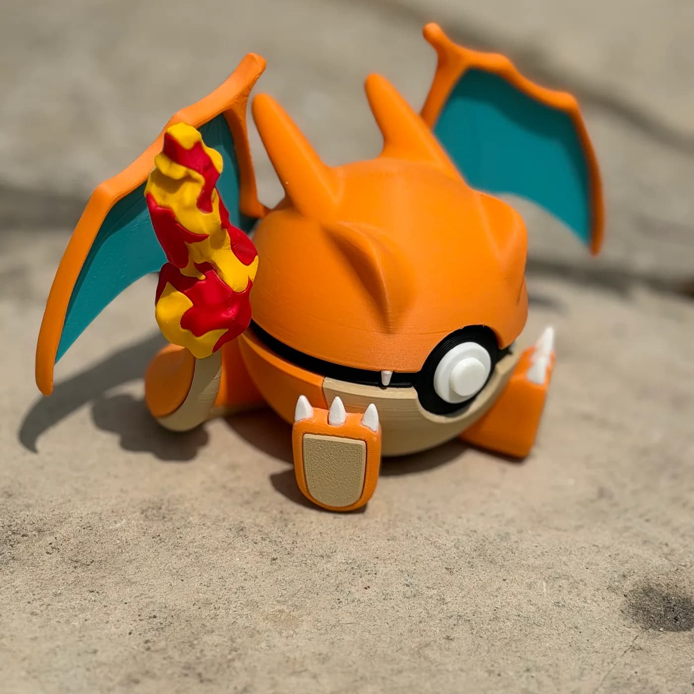 Charizard character ball, wings spread and flame tail raised