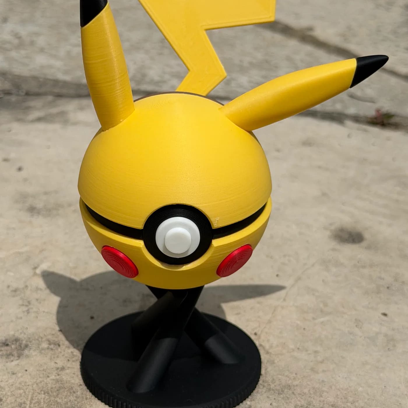 Pikachu character ball upright on a display stand