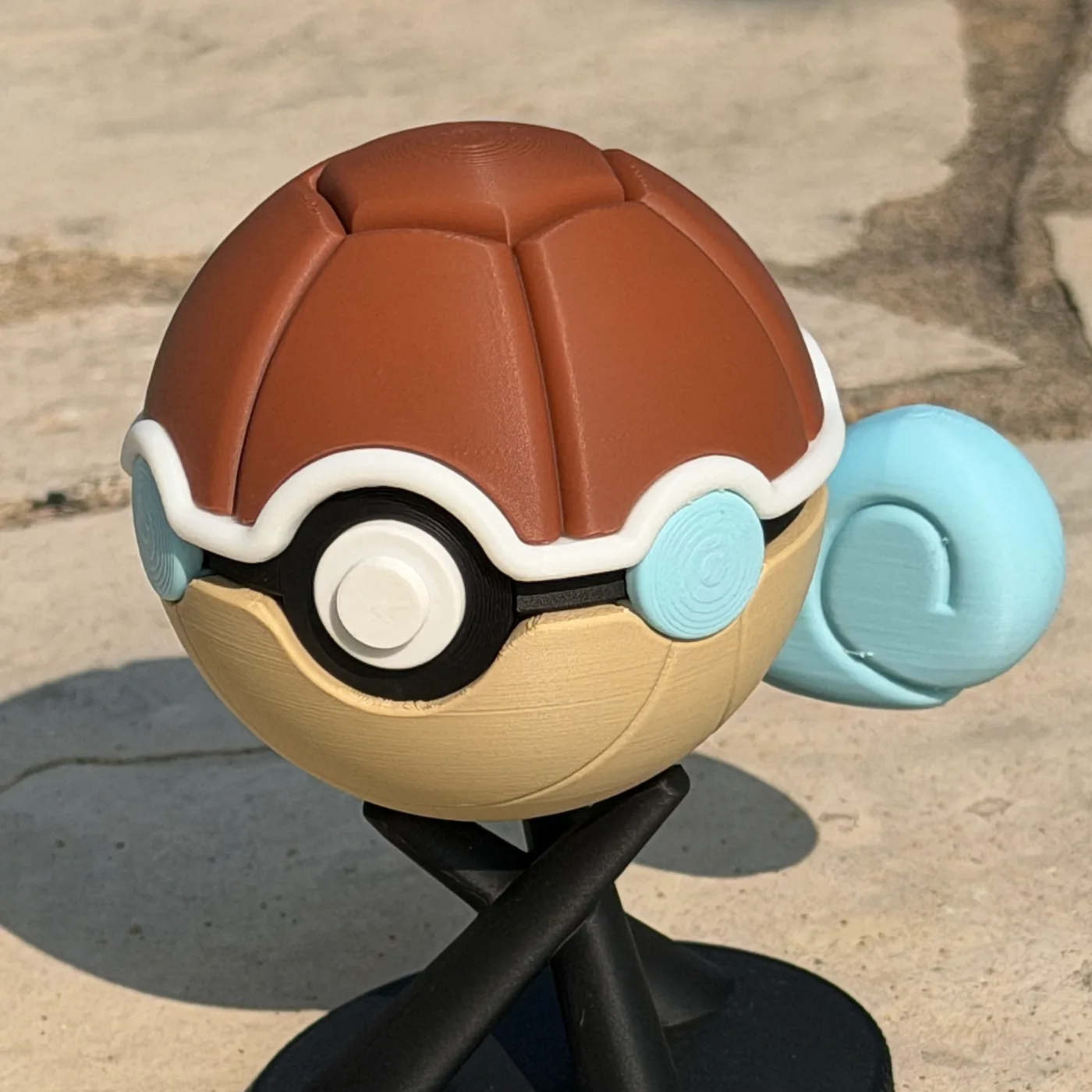 Squirtle character ball with a brown shell and curled blue tail